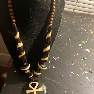 Black and Cream Beaded Necklace with Ankh Pendant
With Earrings
